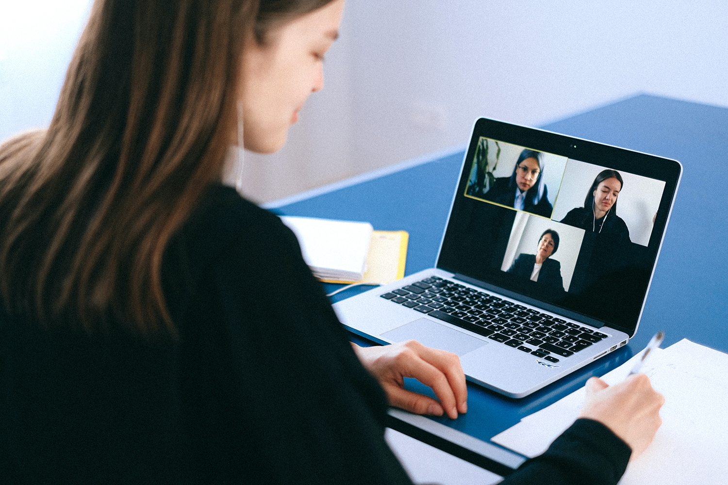 woman on her laptop using zoom