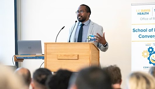 man presenting at podium