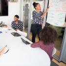 group of women working in a conference room